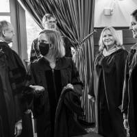 Faculty talking around table